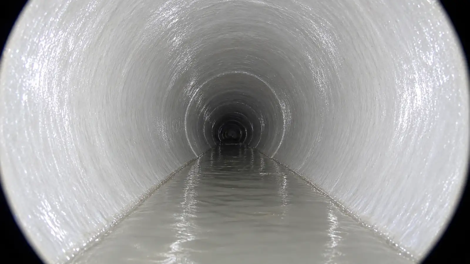 After: the same pipe after CIPP lining, smooth and clear